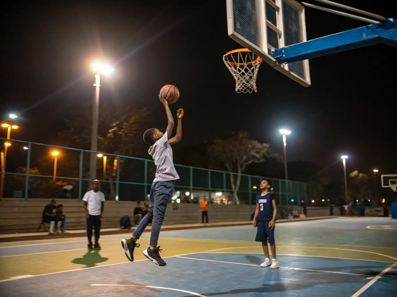 A dynamic image of students participating in a basketball game in the school gymnasium, showcasing the energy and teamwork involved in the sport.